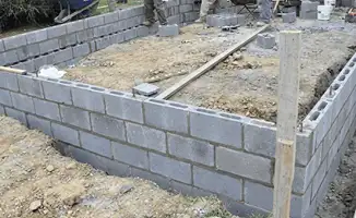 Professionals building a foundation with blocks in Cedar Rapids, IA