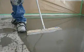 Uneven floor being professionally repaired in Cedar Rapids, IA